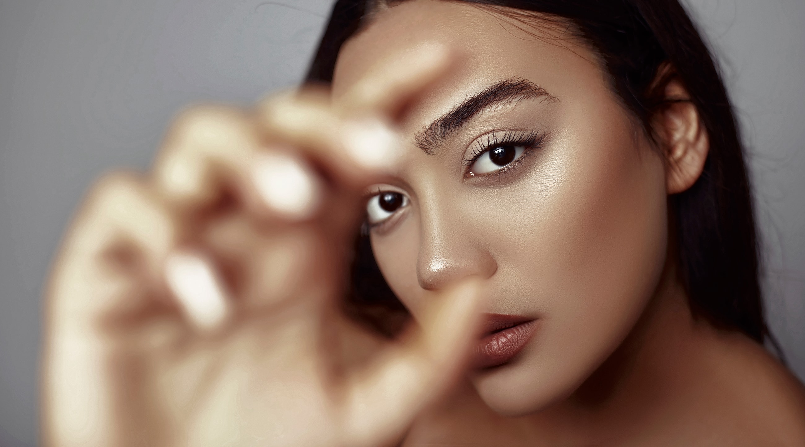 Close-up portrait of a woman with strong gaze.